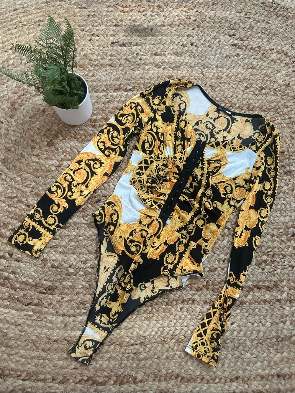 GOLD AND BLACK PRINTED LONG SLEEVE BODYSUIT